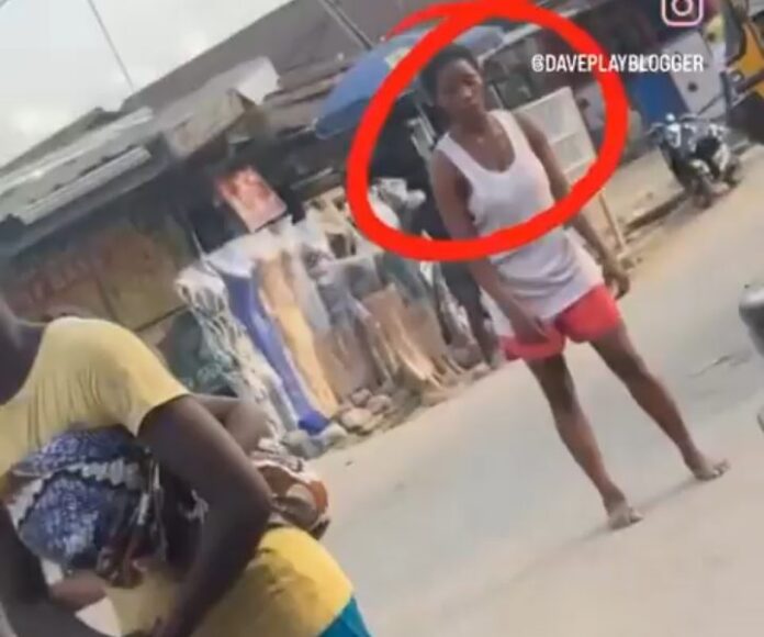 Drug fears as young lady sleeps off standing on the road (Video)