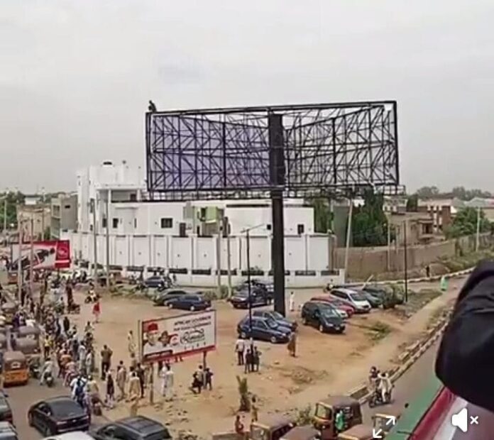 Teenager rescued after climbing billboard in bid to see governor
